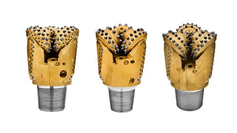 Three rotary drill bits white background